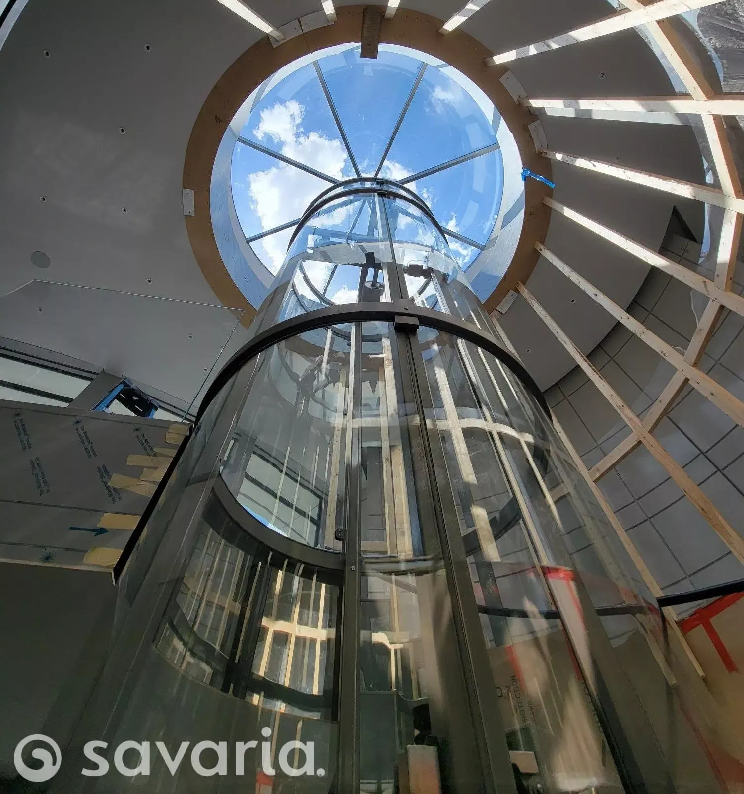 Okan Elevator multistory glass elevator looking up